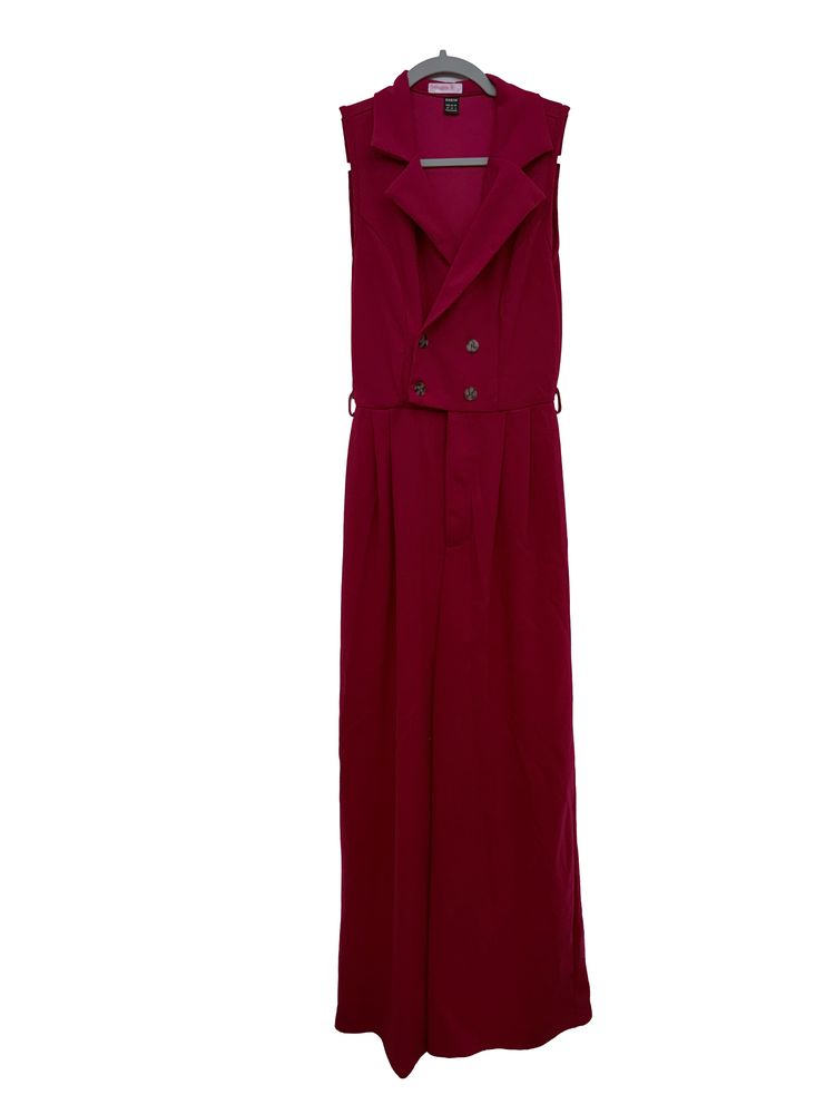 A burgundy floor-length concert dress on a hanger